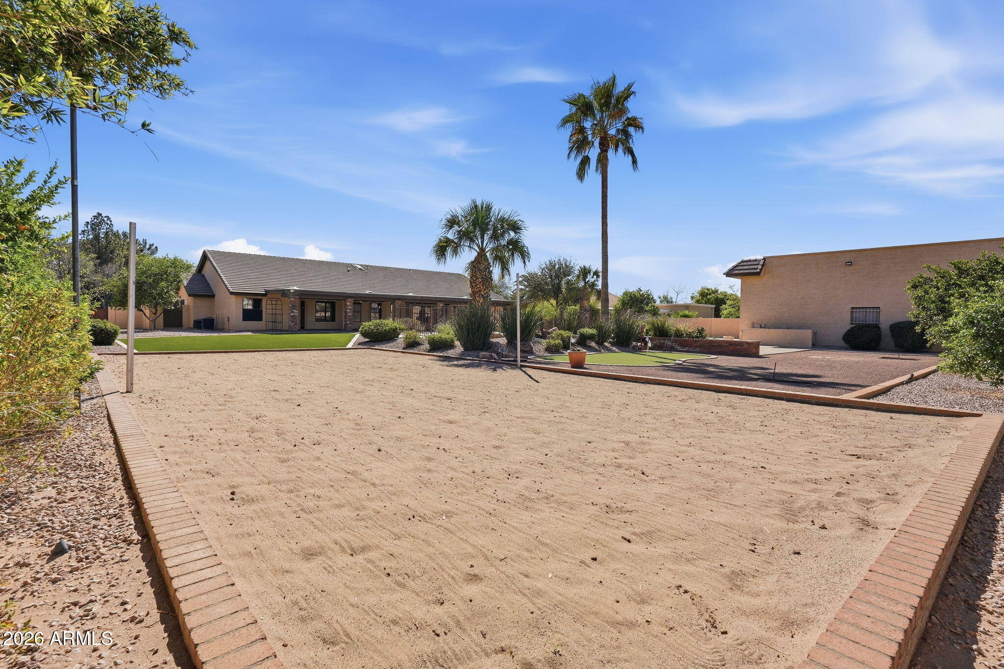 602 East Carver Road Tempe, AZ 85284 - Photo 70 of 85 a view of a building with a yard and palm trees