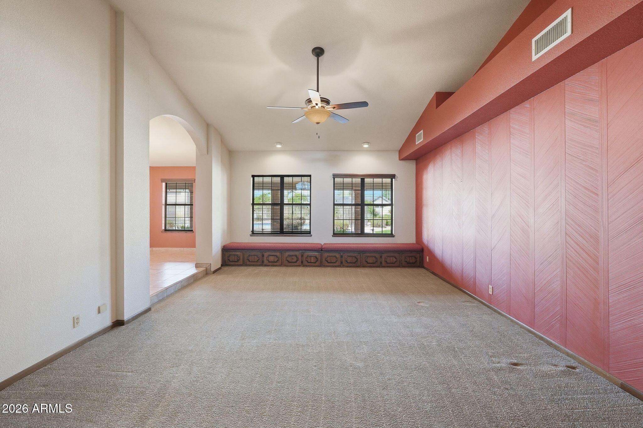602 East Carver Road Tempe, AZ 85284 - Photo 9 of 85 an empty room with chandelier fan and windows