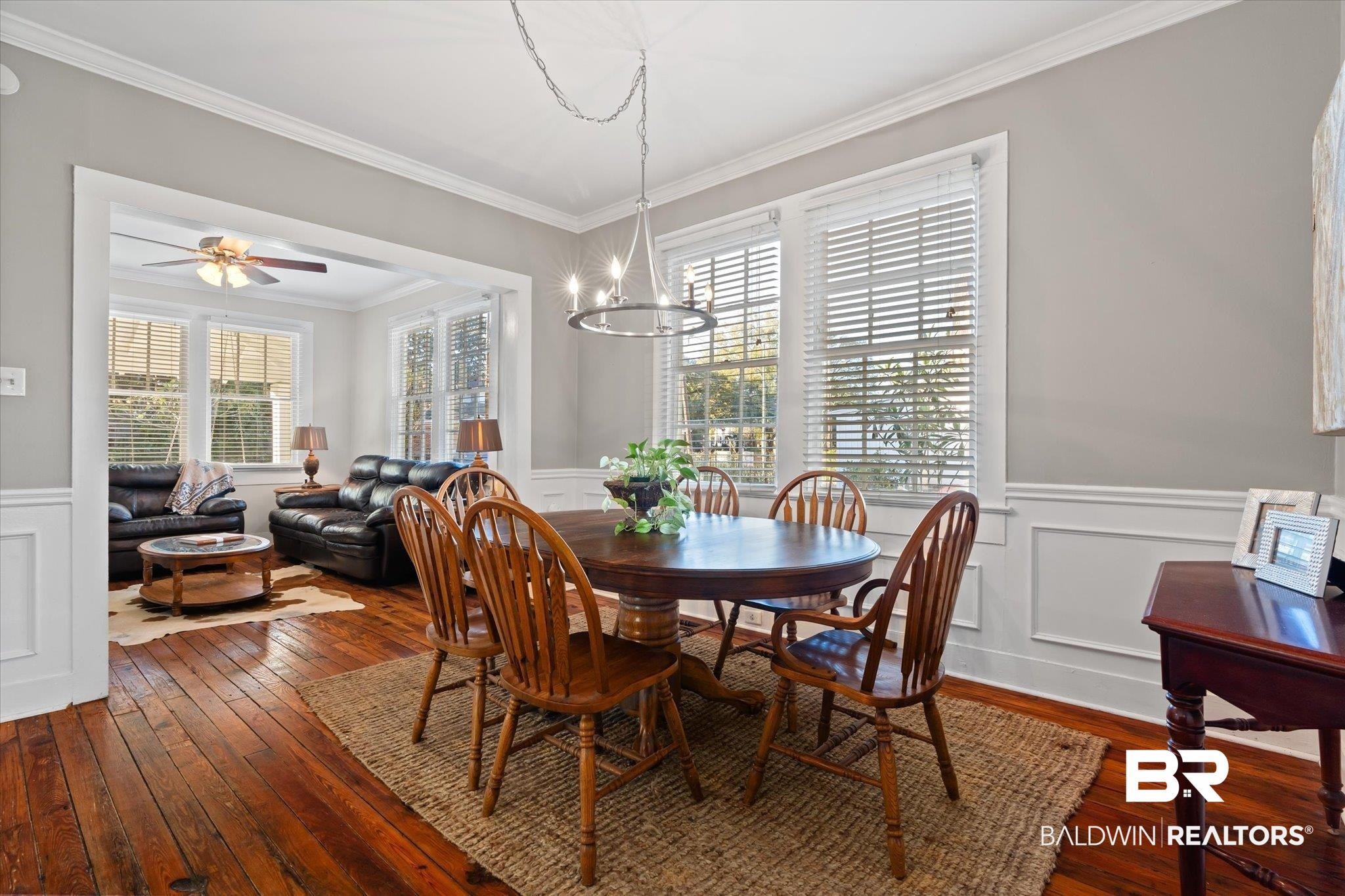 7 Rickarby Place Mobile, AL 36606 - Photo 6 of 20 Dining area with crown molding, wood-type flooring, and ceiling fan with notable chandelier