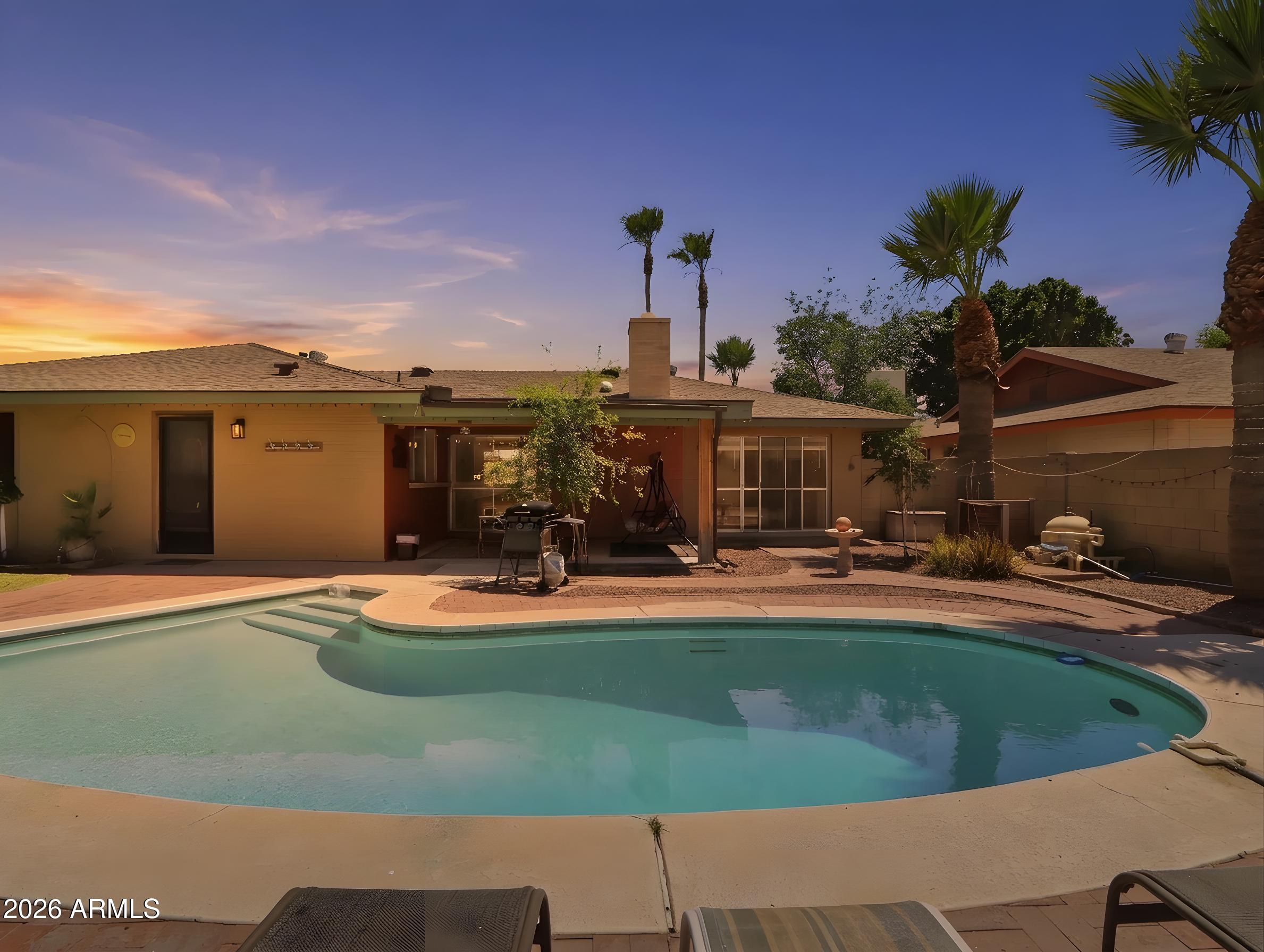 450 Cascada Road Litchfield Park, AZ 85340 - Photo 37 of 40 a view of a house with swimming pool