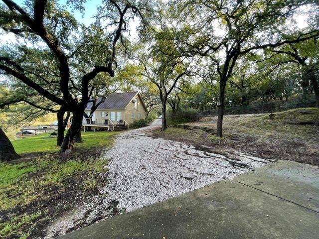 602 Sycamore Road Burnet, TX 78611 - Photo 4 of 26 a view of backyard with tree