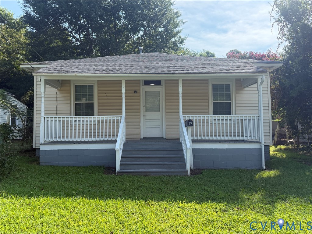 29 Spring Street Petersburg, VA 23803 - Photo 2 of 15 Covered front porch with white railings and column