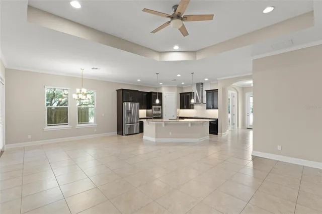 a view of a swimming pool with a patio and a yard