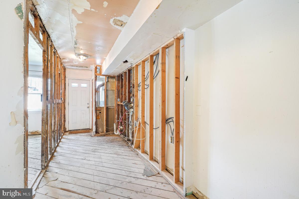 1280 16th Street Northeast Washington, DC 20002 - Photo 21 of 33 a view of a hallway with wooden floor and staircase