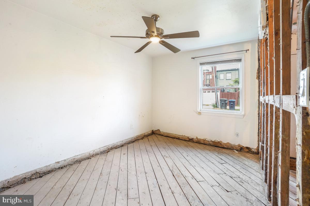 1280 16th Street Northeast Washington, DC 20002 - Photo 25 of 33 an empty room with wooden floor fan and windows
