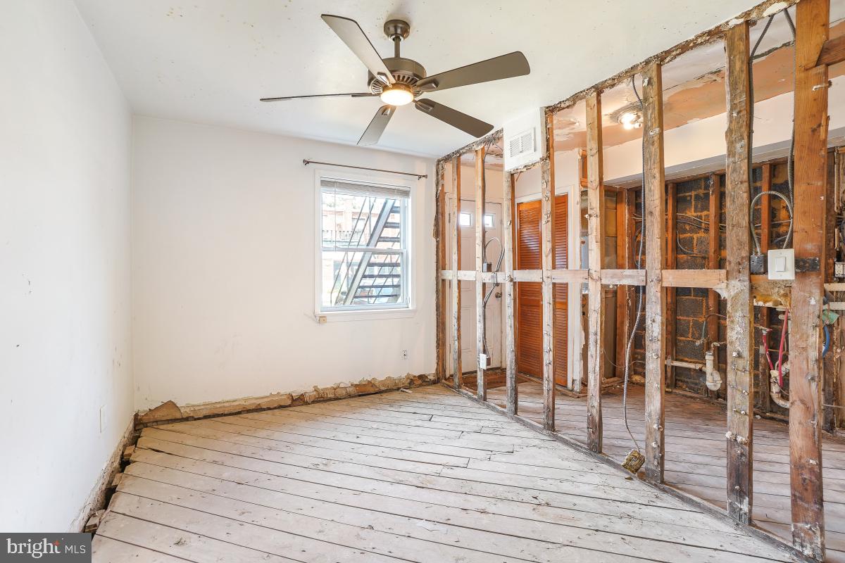 1280 16th Street Northeast Washington, DC 20002 - Photo 26 of 33 a view of a livingroom with wooden floor and a ceiling fan