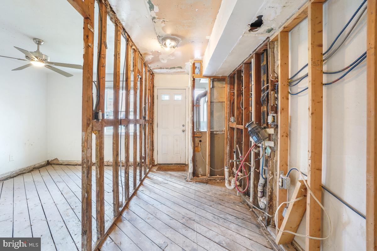 1280 16th Street Northeast Washington, DC 20002 - Photo 29 of 33 a view of a hallway with wooden floor and staircase
