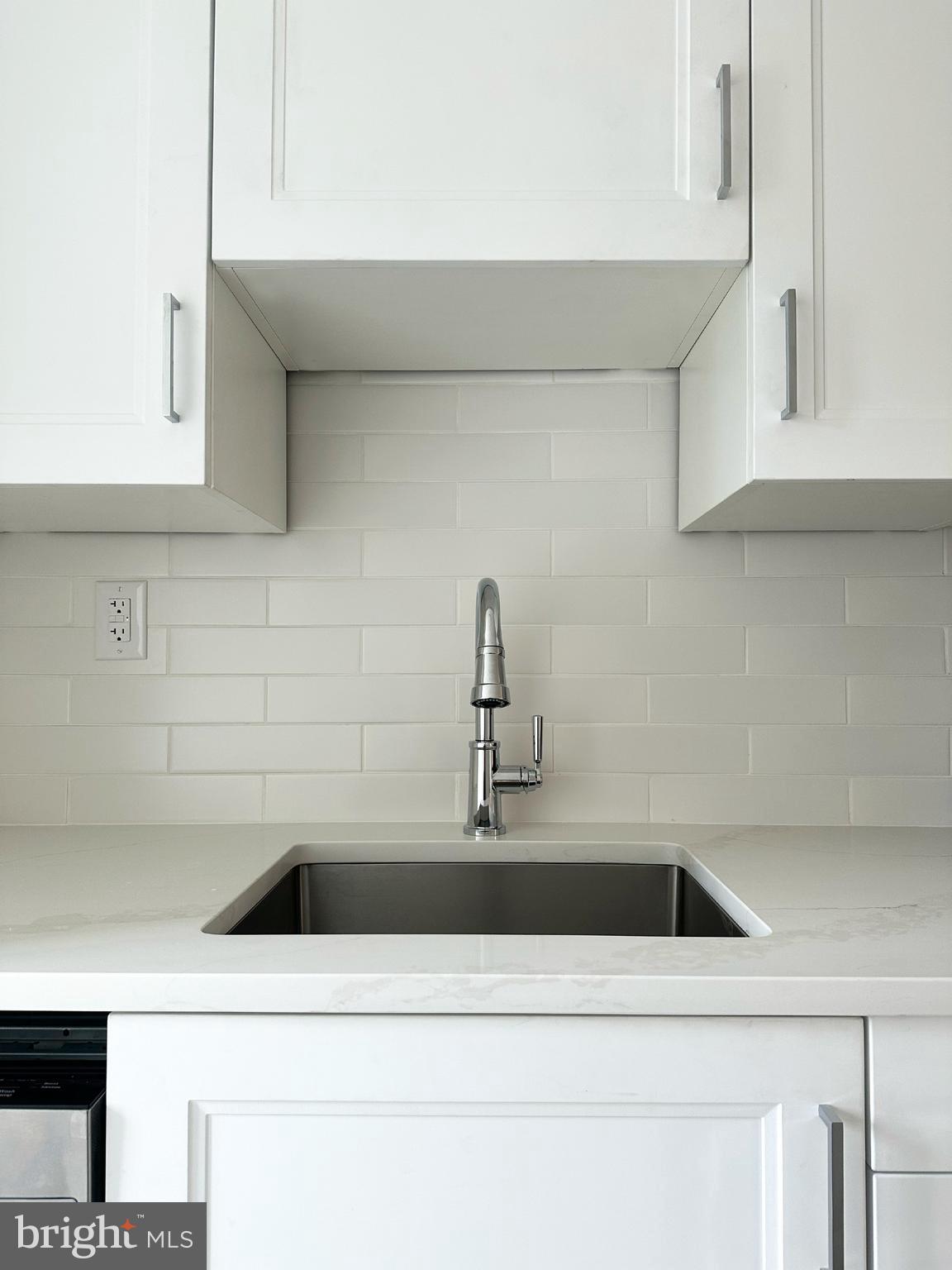 1280 16th Street Northeast Washington, DC 20002 - Photo 5 of 33 a kitchen with a sink and cabinets
