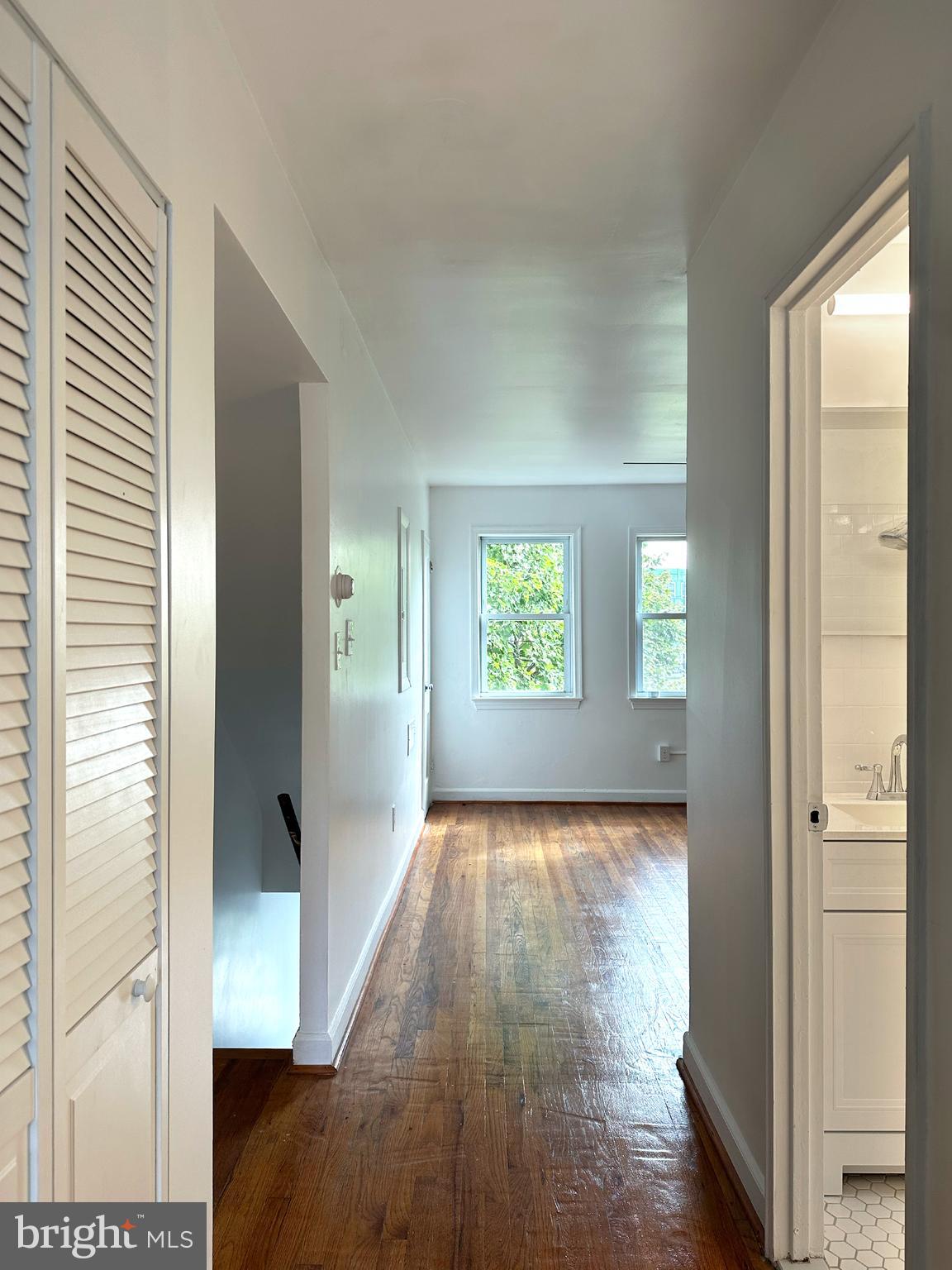 1280 16th Street Northeast Washington, DC 20002 - Photo 10 of 33 a view of hallway with window and wooden floor