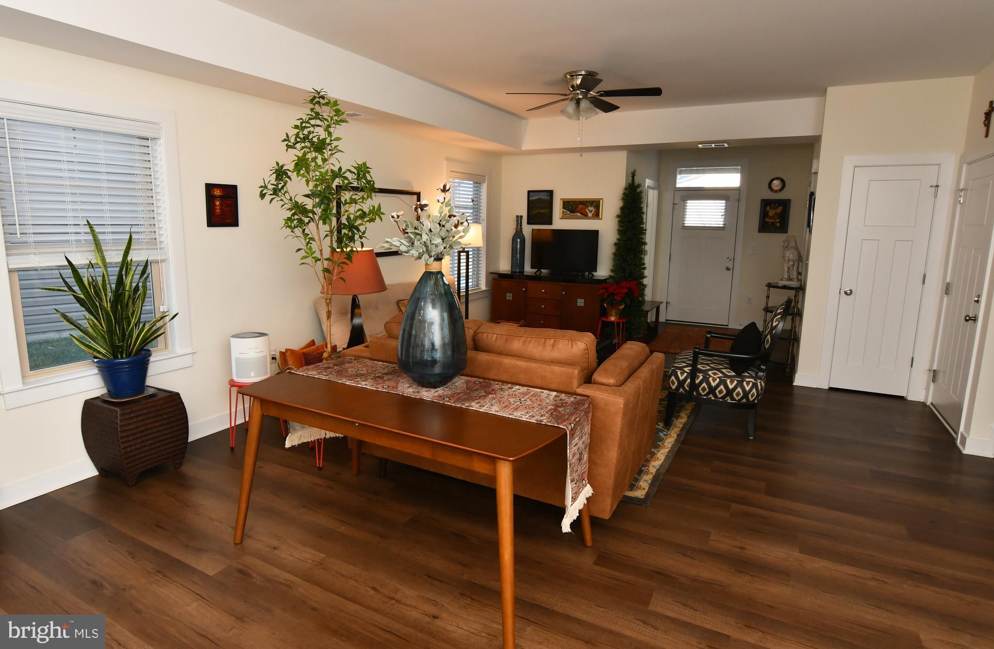 129 Doonbeg Court Winchester, VA 22602 - Photo 11 of 51 a living room with furniture potted plant and a wooden floor