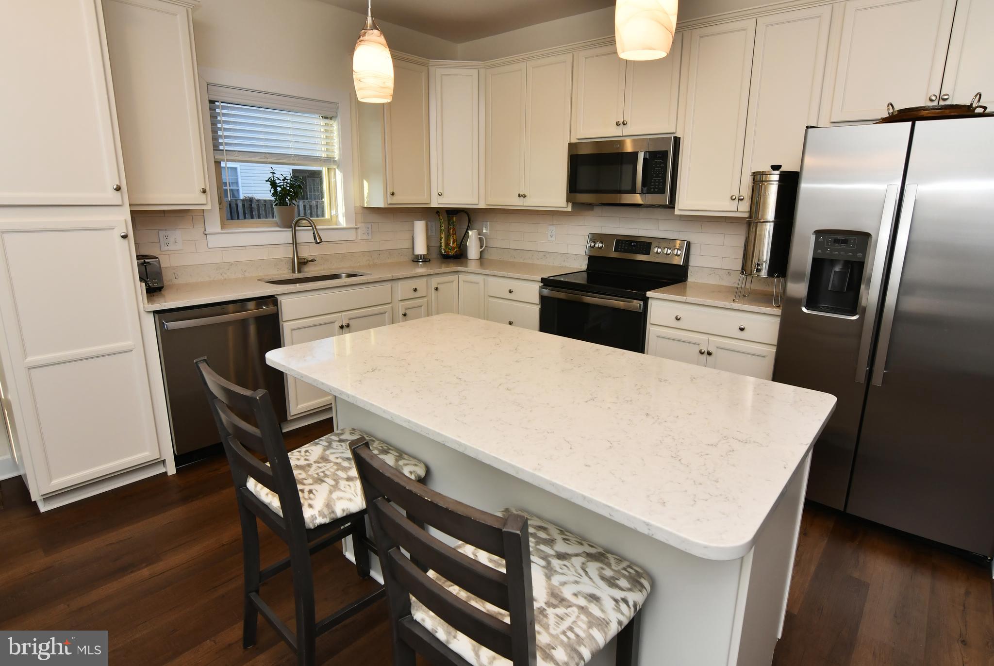 129 Doonbeg Court Winchester, VA 22602 - Photo 17 of 51 a kitchen with a stove a sink a microwave and refrigerator