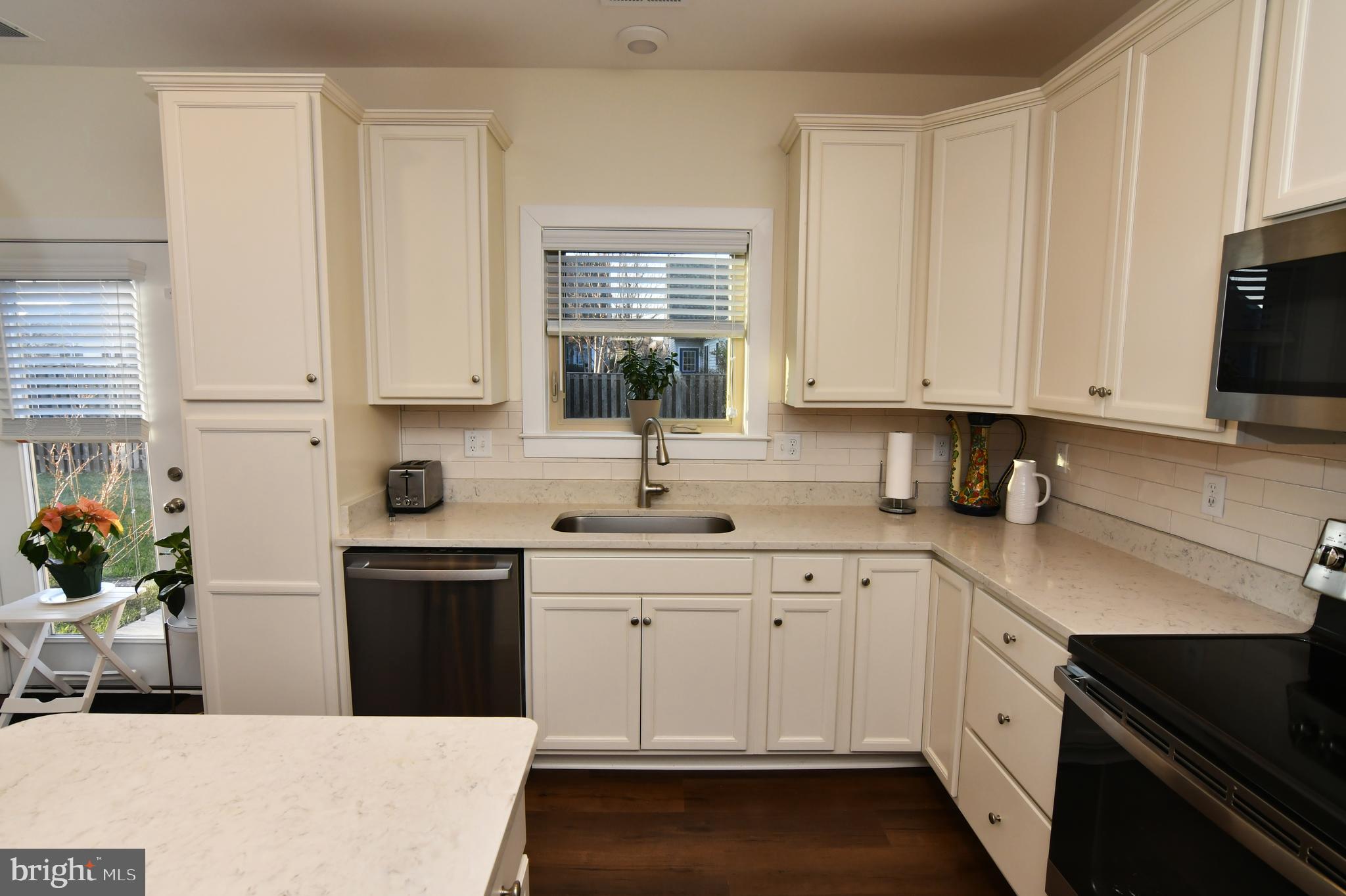 129 Doonbeg Court Winchester, VA 22602 - Photo 18 of 51 a kitchen with white cabinets and sink