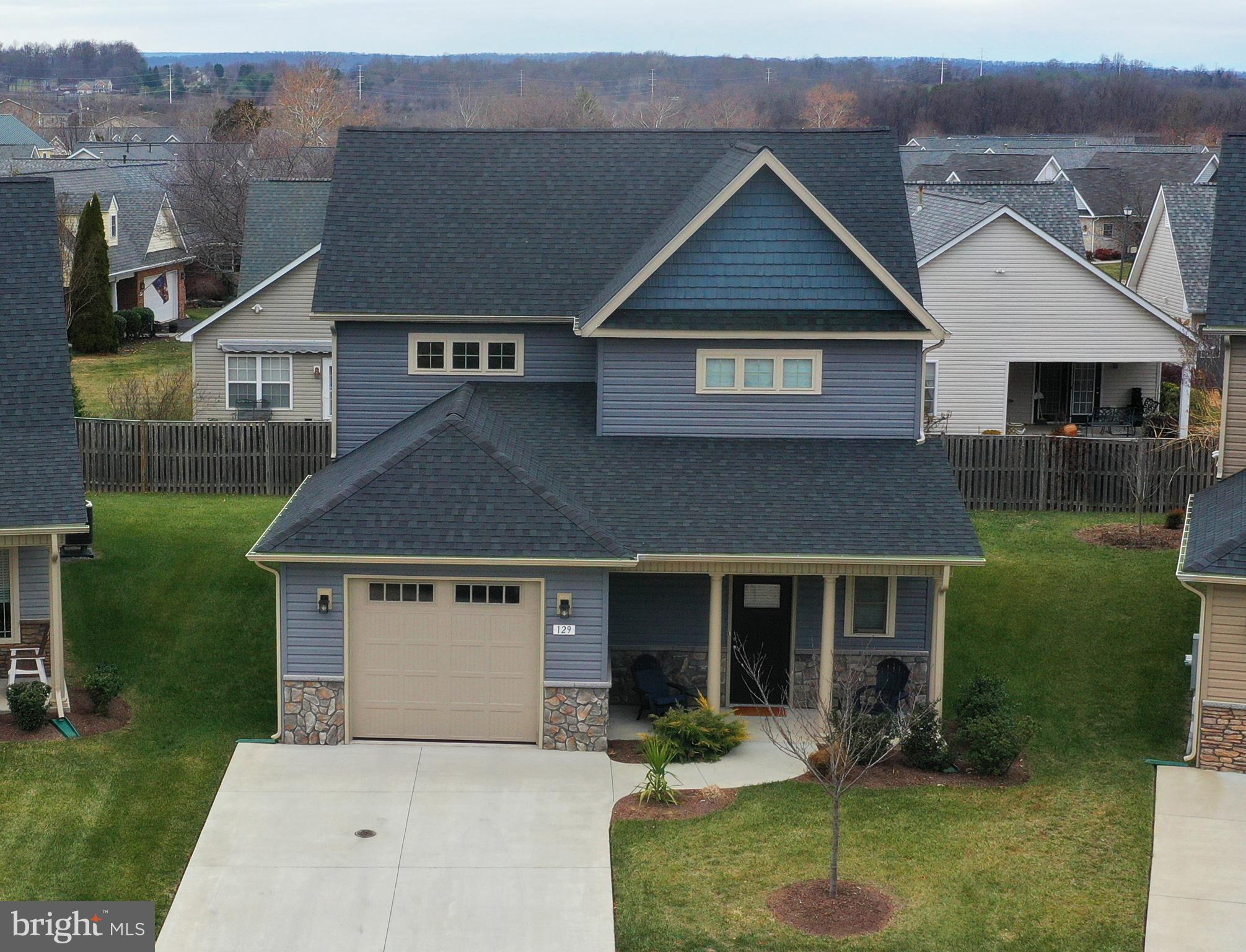 129 Doonbeg Court Winchester, VA 22602 - Photo 2 of 51 a front view of a house with garden