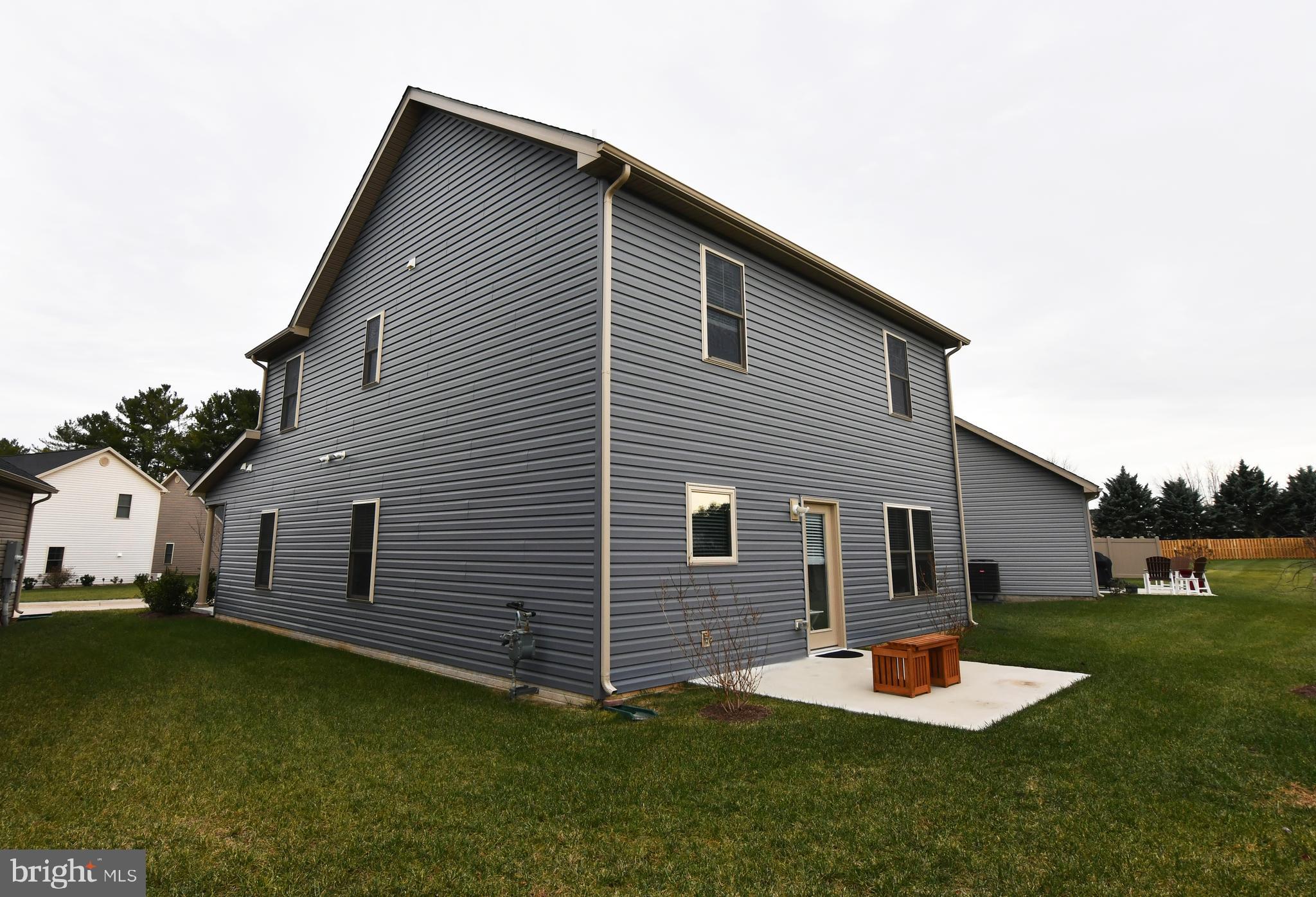 129 Doonbeg Court Winchester, VA 22602 - Photo 50 of 51 a front view of a house with a yard and trees