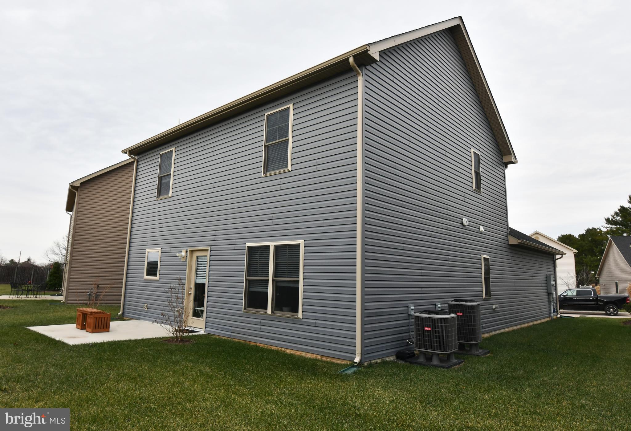 129 Doonbeg Court Winchester, VA 22602 - Photo 51 of 51 a backyard of a house with table and chairs