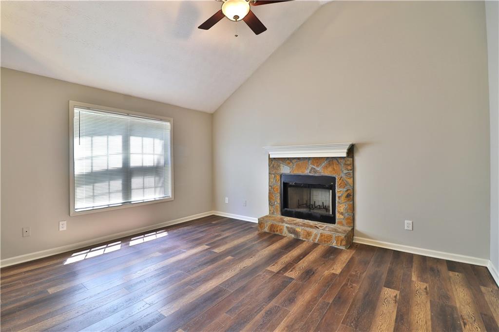 353 Fall View Court Winder, GA 30680 - Photo 21 of 61 an empty room with ceiling fan and windows
