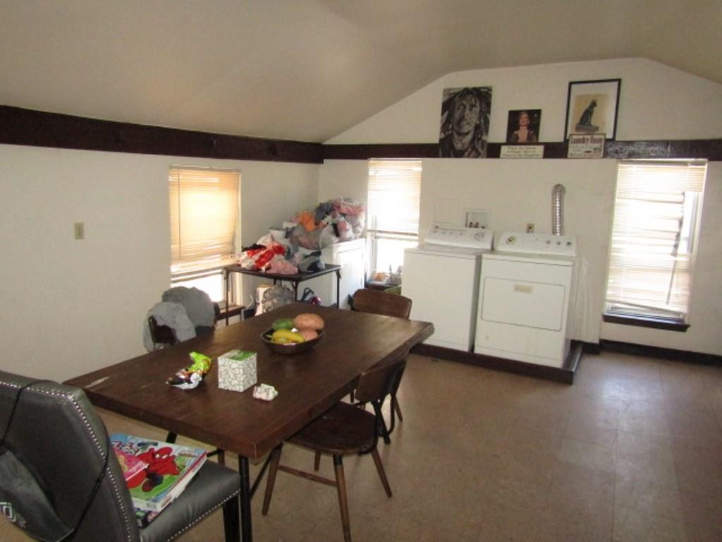 606 Middle Street Pittsburgh, PA 15212 - Photo 18 of 39 a view of a dining room with furniture and chandelier