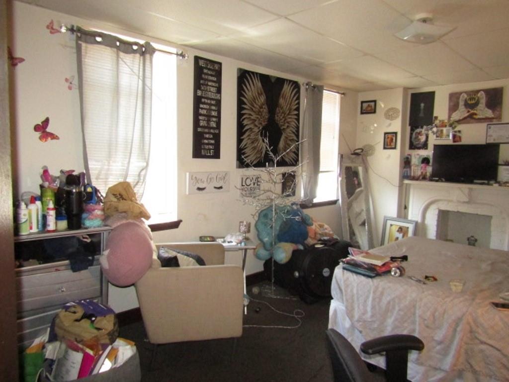 606 Middle Street Pittsburgh, PA 15212 - Photo 28 of 39 a living room with furniture and a flat screen tv