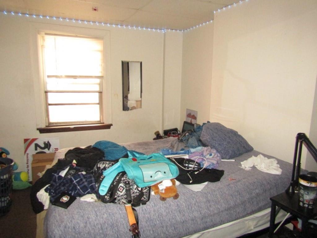 606 Middle Street Pittsburgh, PA 15212 - Photo 32 of 39 a bedroom with a bed and a window