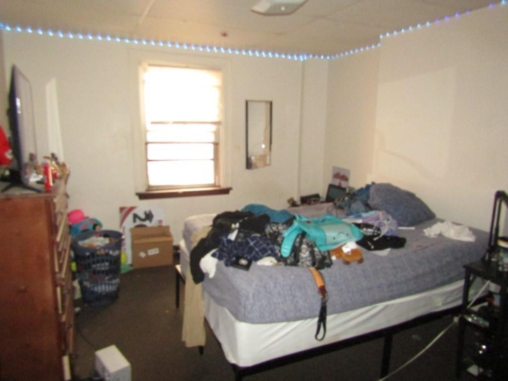 606 Middle Street Pittsburgh, PA 15212 - Photo 34 of 39 a bedroom with furniture and a window
