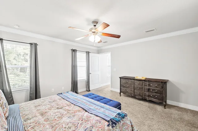 a bathroom with a granite countertop sink a toilet and a mirror