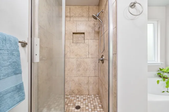 a view of balcony with wooden floor and fence