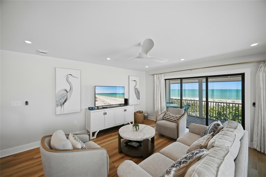 380 Gulf Boulevard, Unit 1 Boca Grande, FL 33921 - Photo 11 of 35 a living room with furniture and a large window