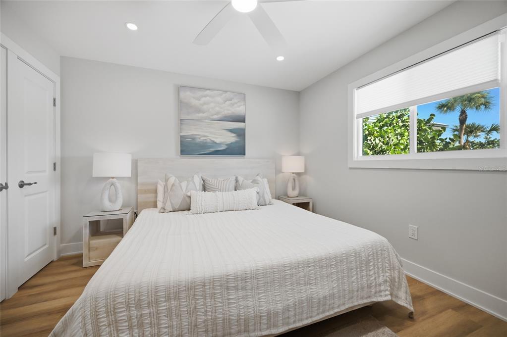 380 Gulf Boulevard, Unit 1 Boca Grande, FL 33921 - Photo 19 of 35 a bedroom with a bed and a painting on the wall