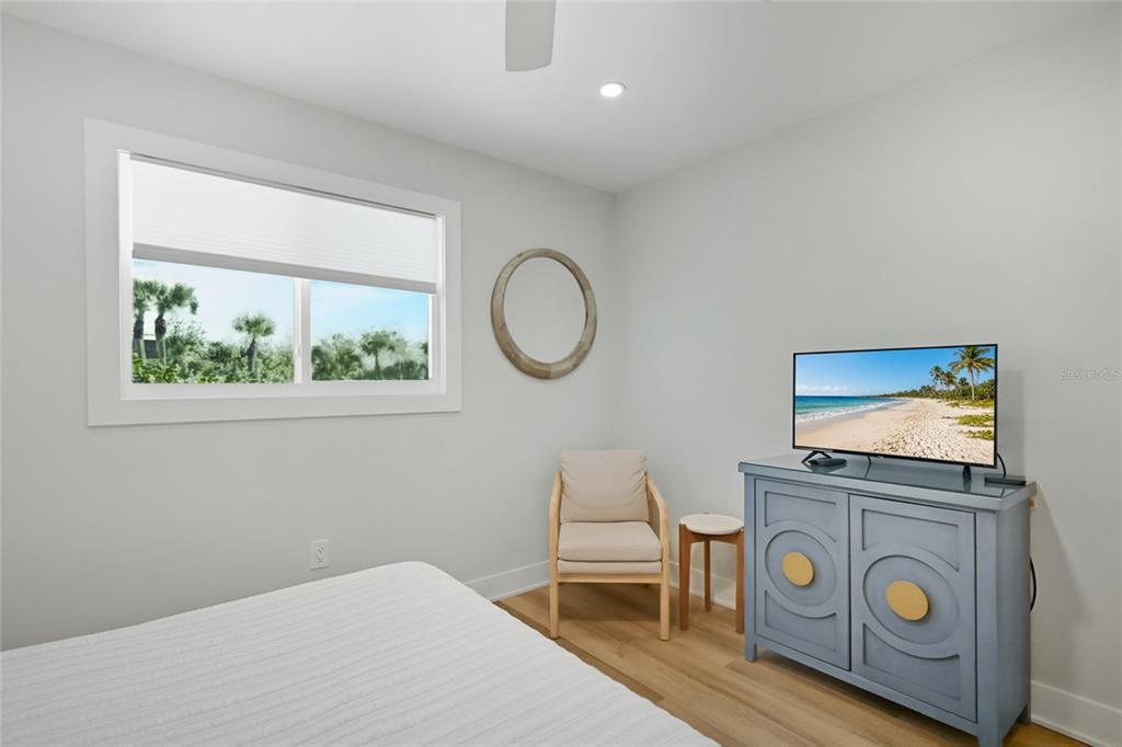 380 Gulf Boulevard, Unit 1 Boca Grande, FL 33921 - Photo 21 of 35 a bedroom with a bed and a window
