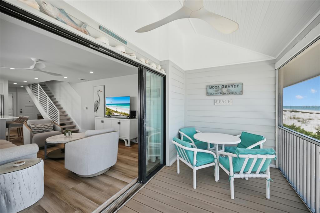 380 Gulf Boulevard, Unit 1 Boca Grande, FL 33921 - Photo 25 of 35 a living room with furniture and a wooden floor