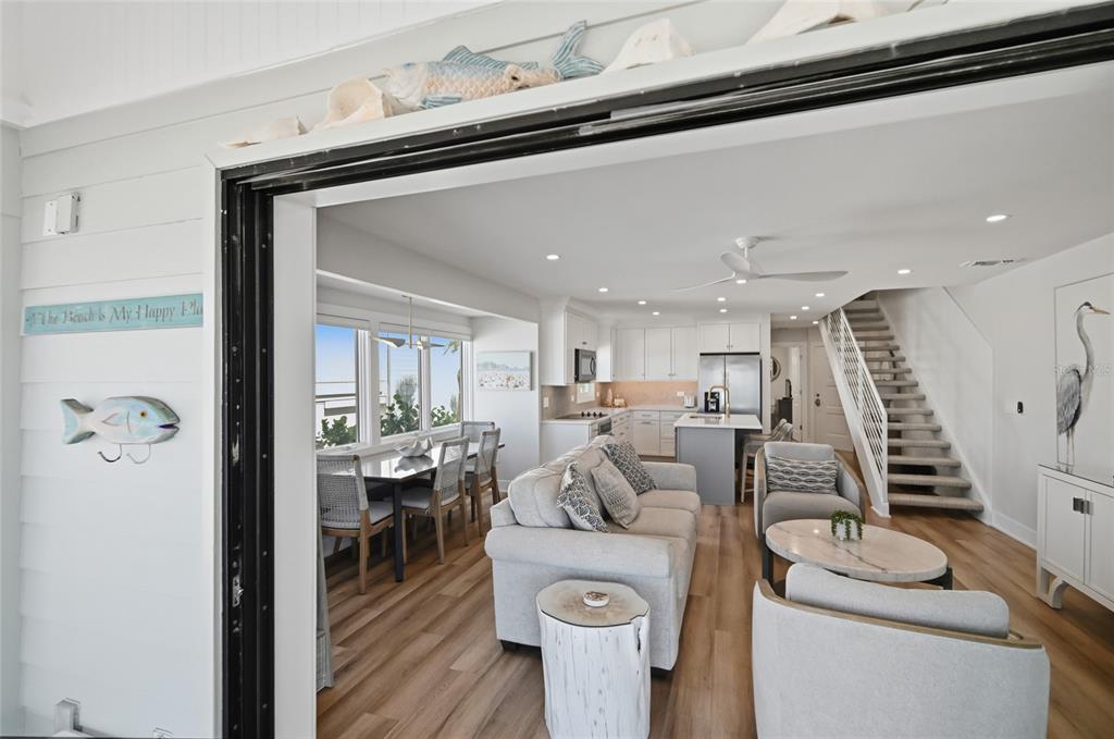 380 Gulf Boulevard, Unit 1 Boca Grande, FL 33921 - Photo 26 of 35 a living room with furniture a couch and wooden floor