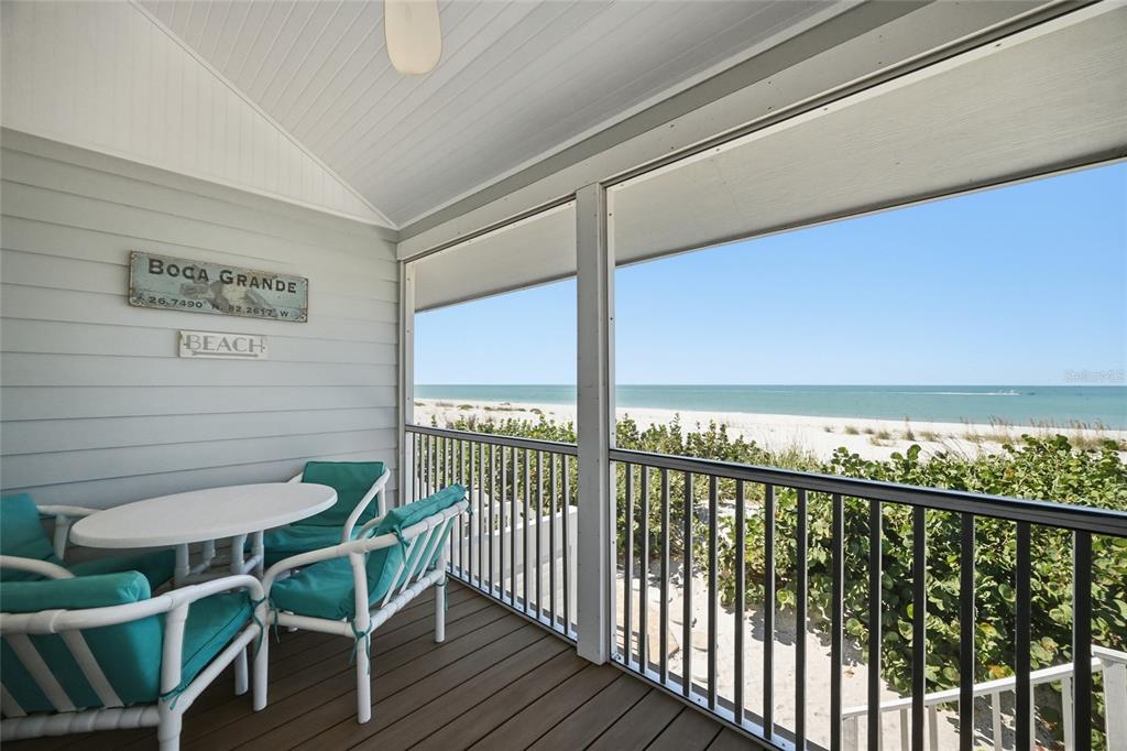380 Gulf Boulevard, Unit 1 Boca Grande, FL 33921 - Photo 3 of 35 a view of a chairs and table in the balcony