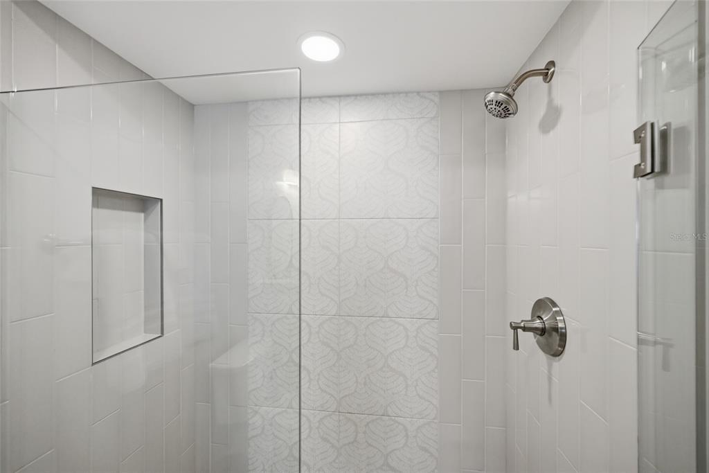 380 Gulf Boulevard, Unit 1 Boca Grande, FL 33921 - Photo 34 of 35 a bathroom with a shower and a glass door