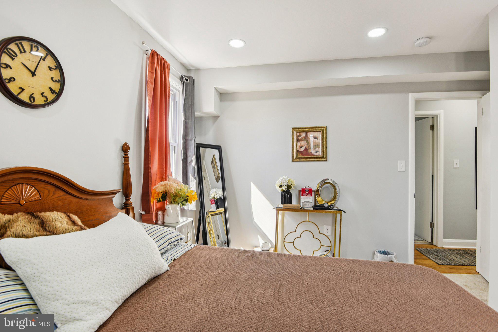 7004 Arion Road Baltimore, MD 21234 - Photo 13 of 43 a bedroom with furniture and a large mirror