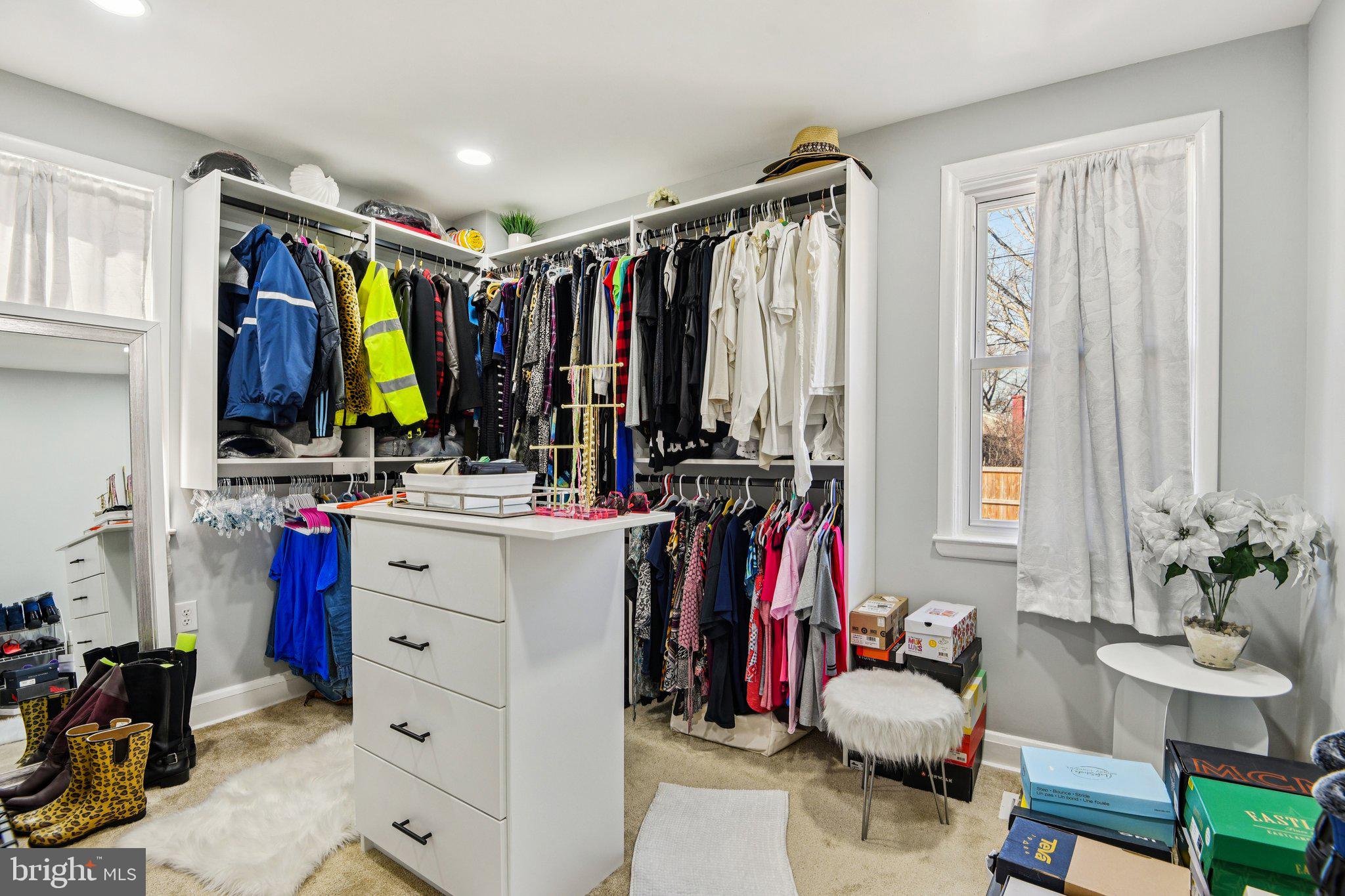 7004 Arion Road Baltimore, MD 21234 - Photo 15 of 43 a view of walk in closet with clothes and shoes