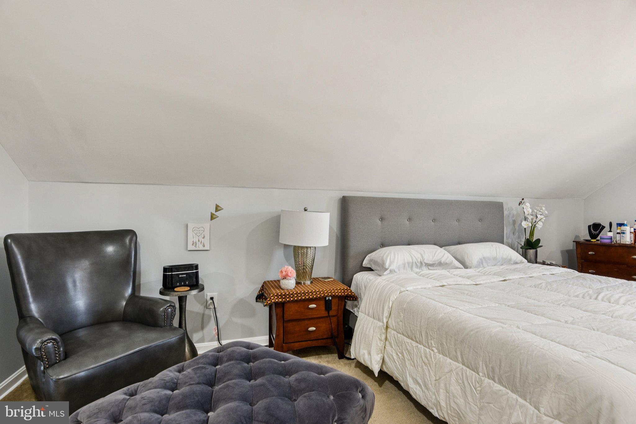 7004 Arion Road Baltimore, MD 21234 - Photo 17 of 43 a bedroom with a bed and furniture