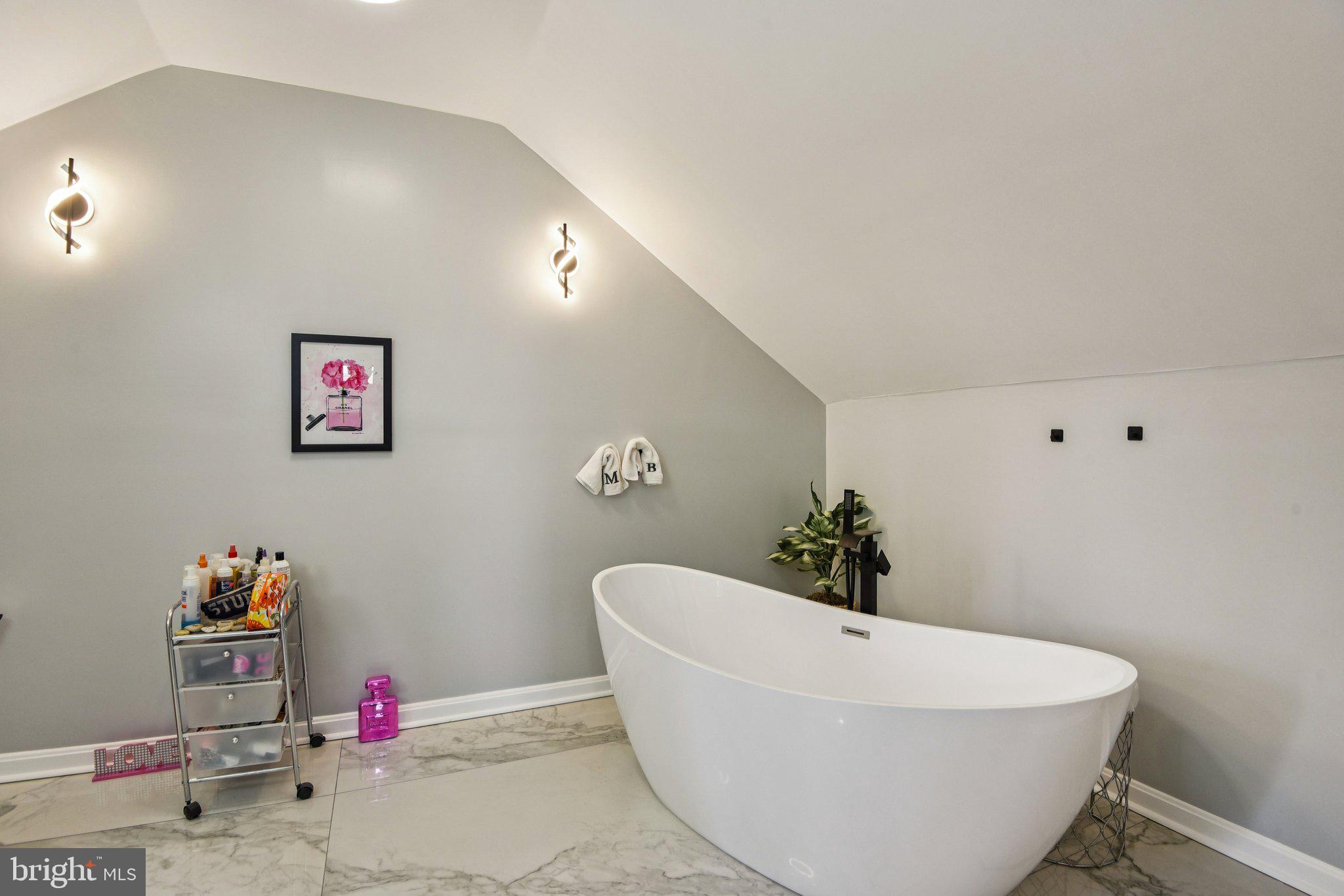 7004 Arion Road Baltimore, MD 21234 - Photo 21 of 43 a white bath tub sitting next to a white sink