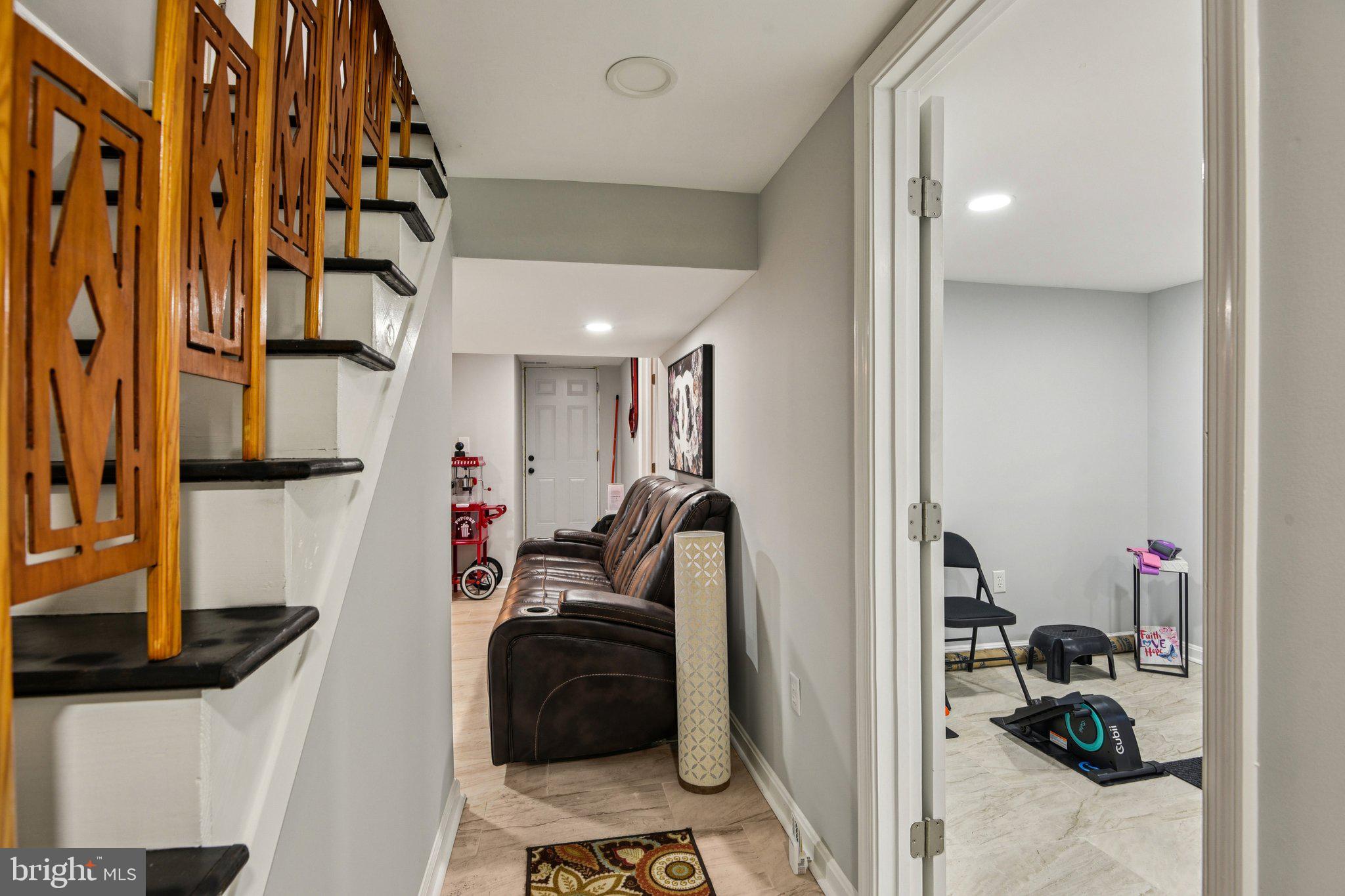 7004 Arion Road Baltimore, MD 21234 - Photo 24 of 43 a view of a hallway with workspace and a couch