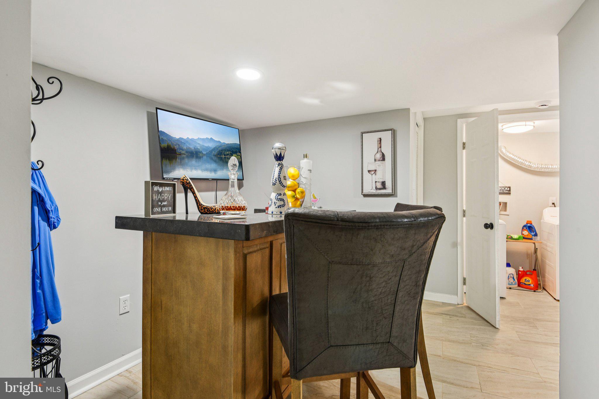 7004 Arion Road Baltimore, MD 21234 - Photo 30 of 43 a living room with furniture and a flat screen tv
