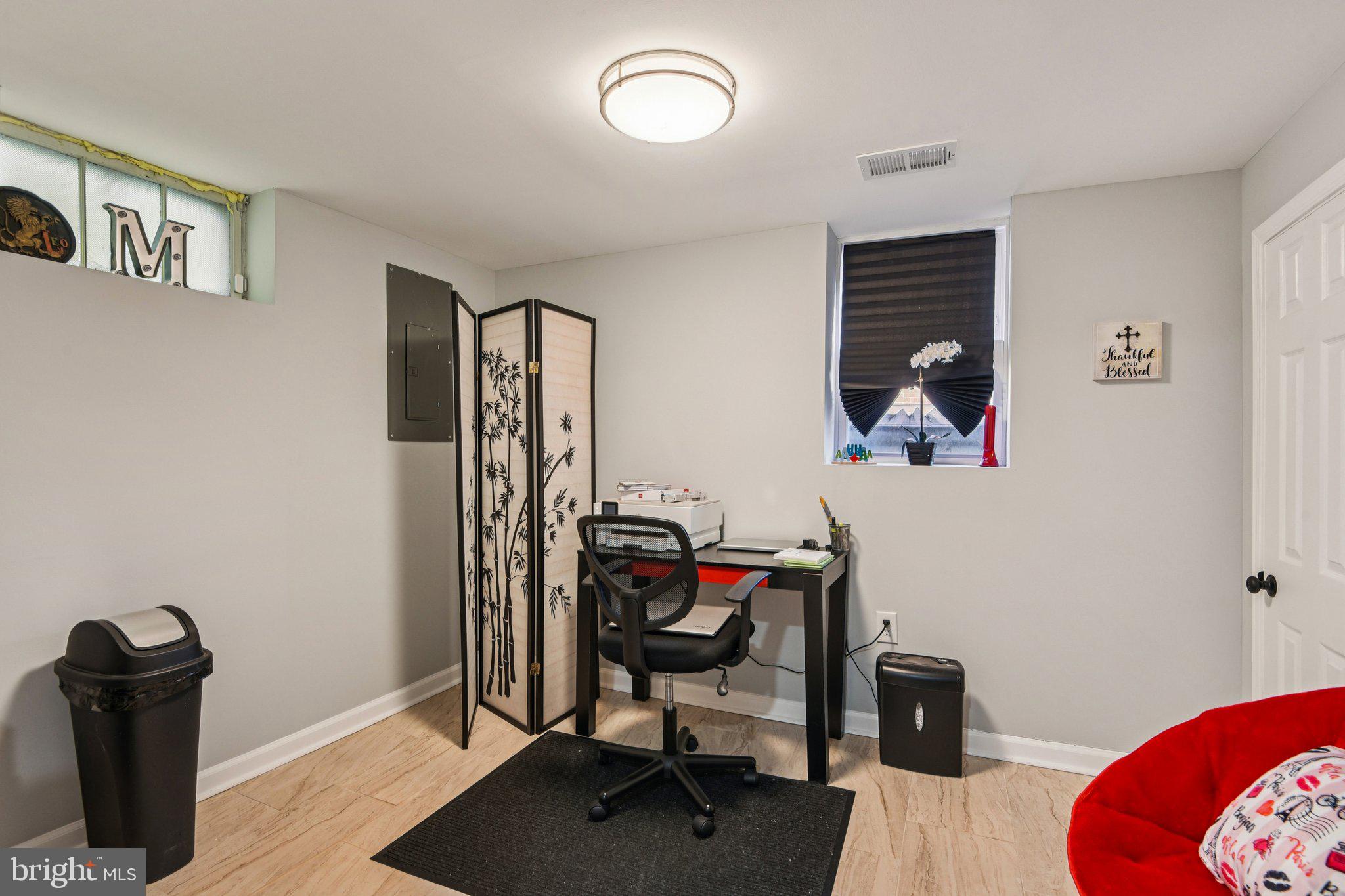 7004 Arion Road Baltimore, MD 21234 - Photo 32 of 43 a view of a workspace with furniture and a window