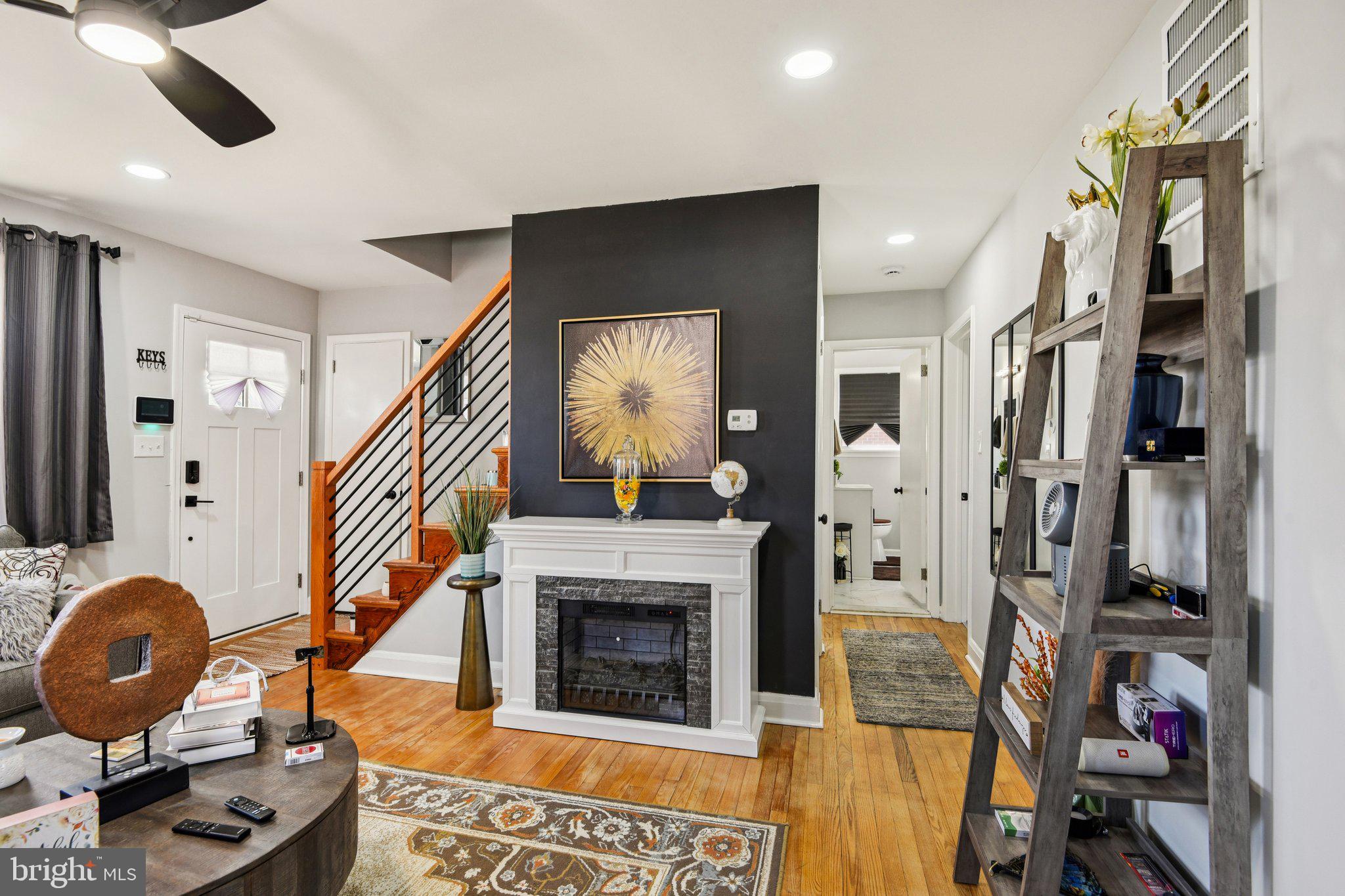 7004 Arion Road Baltimore, MD 21234 - Photo 7 of 43 a living room with furniture and a fireplace