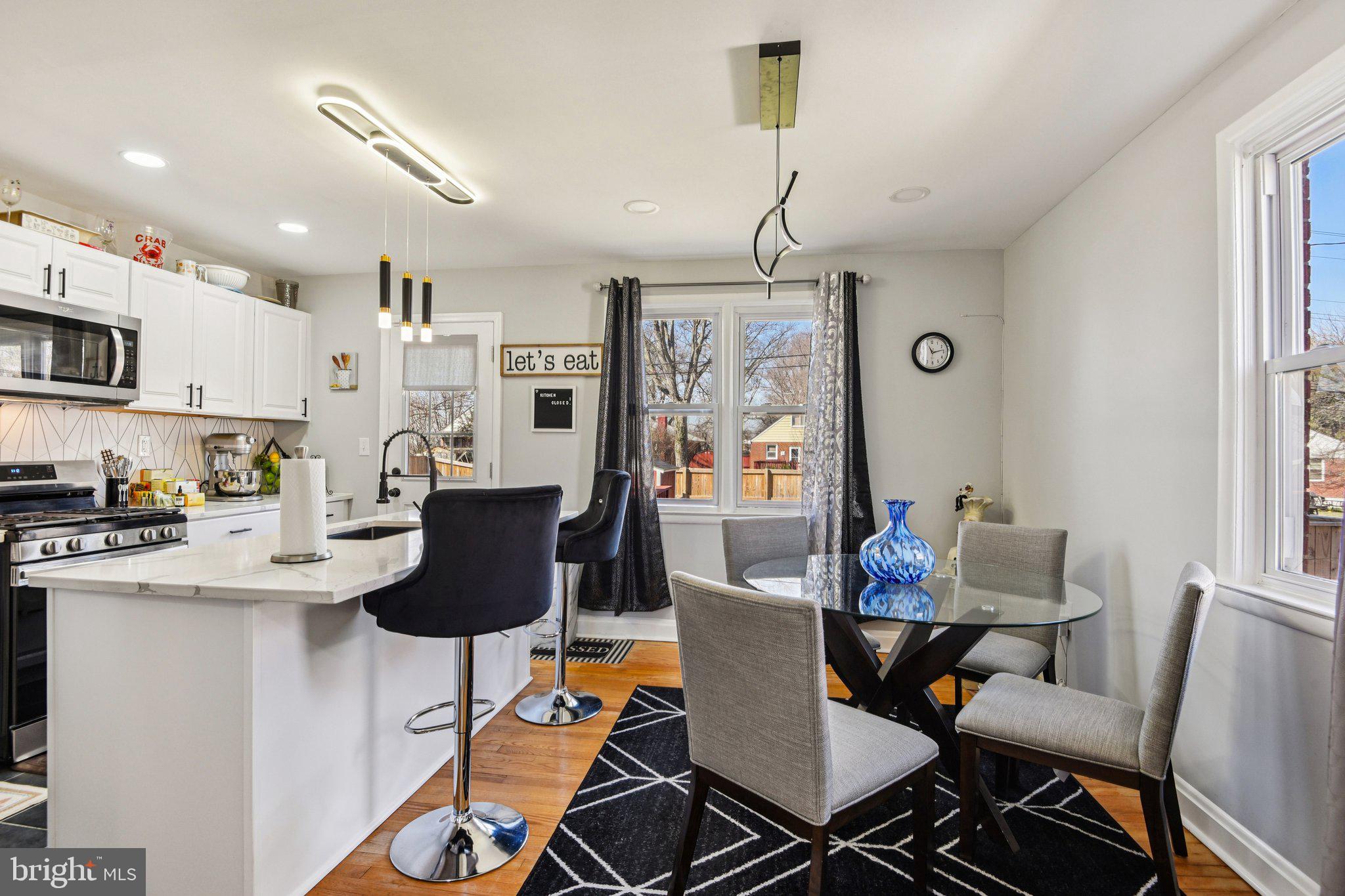 7004 Arion Road Baltimore, MD 21234 - Photo 8 of 43 a dining room with furniture and a chandelier