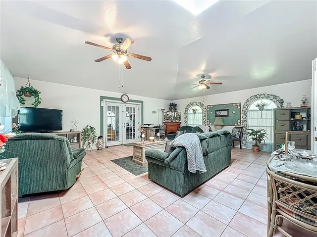 a bedroom with bed and a chandelier