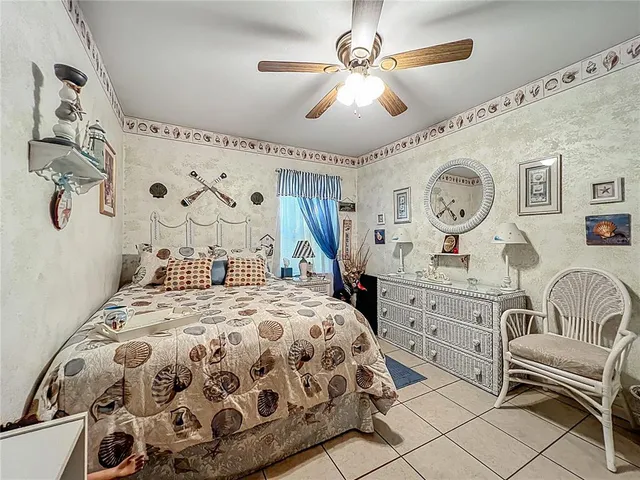 a bed room with a bed and a television