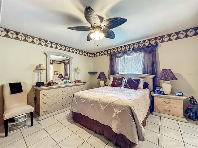 a view of living room with furniture and a potted plant