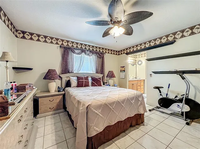 a vase of flowers sitting on a floor