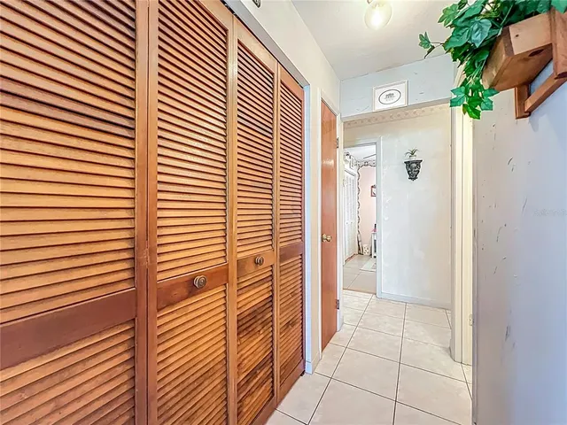 a aerial view of a house with a yard table and chairs