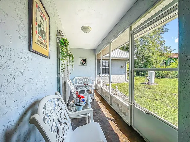 an aerial view of a residential houses with outdoor space and street view