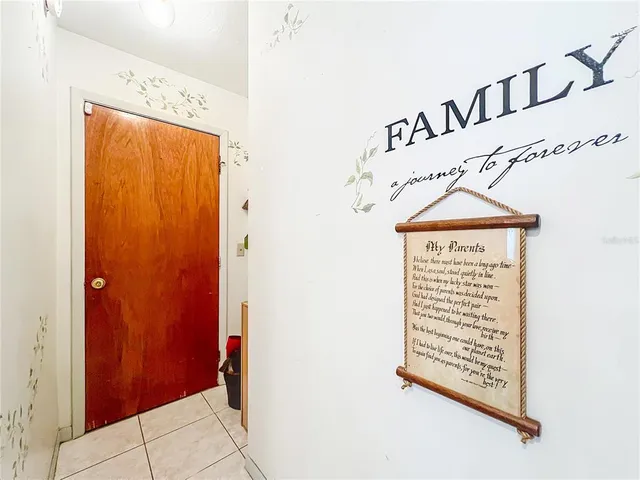 an aerial view of a residential houses with outdoor space and street view