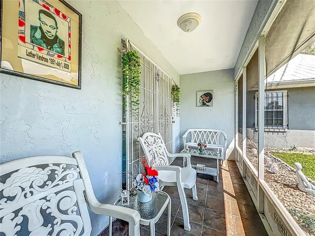 an aerial view of residential houses with outdoor space and street view